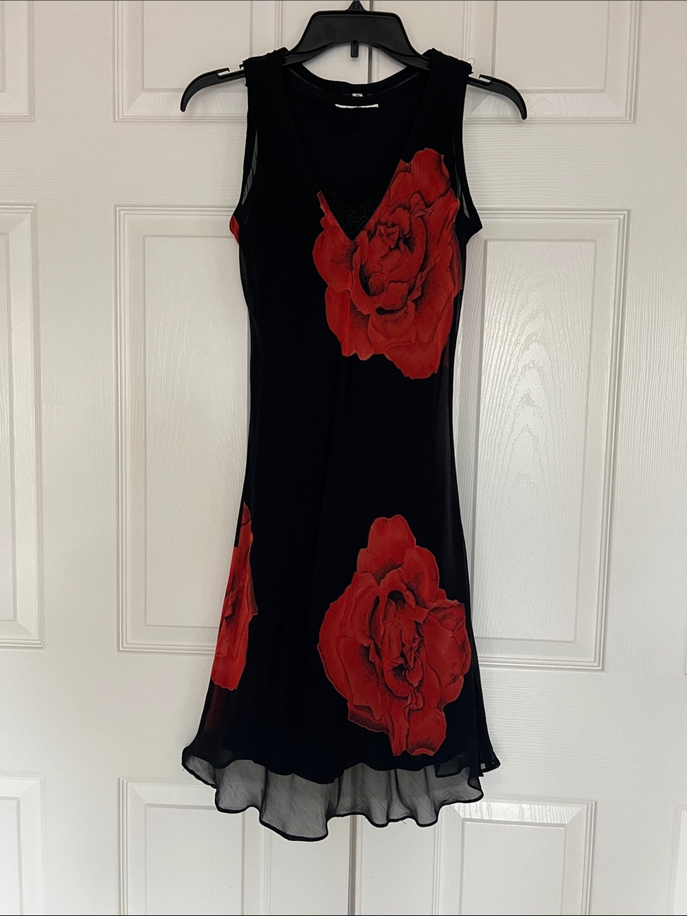 Black Sleeveless Midi Dress with Bold Red Floral Accents Flowing  Fabric